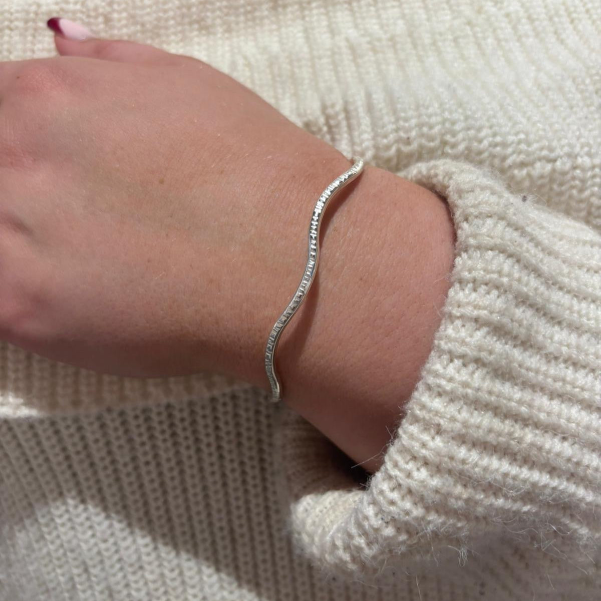 Textured wave silver bangle