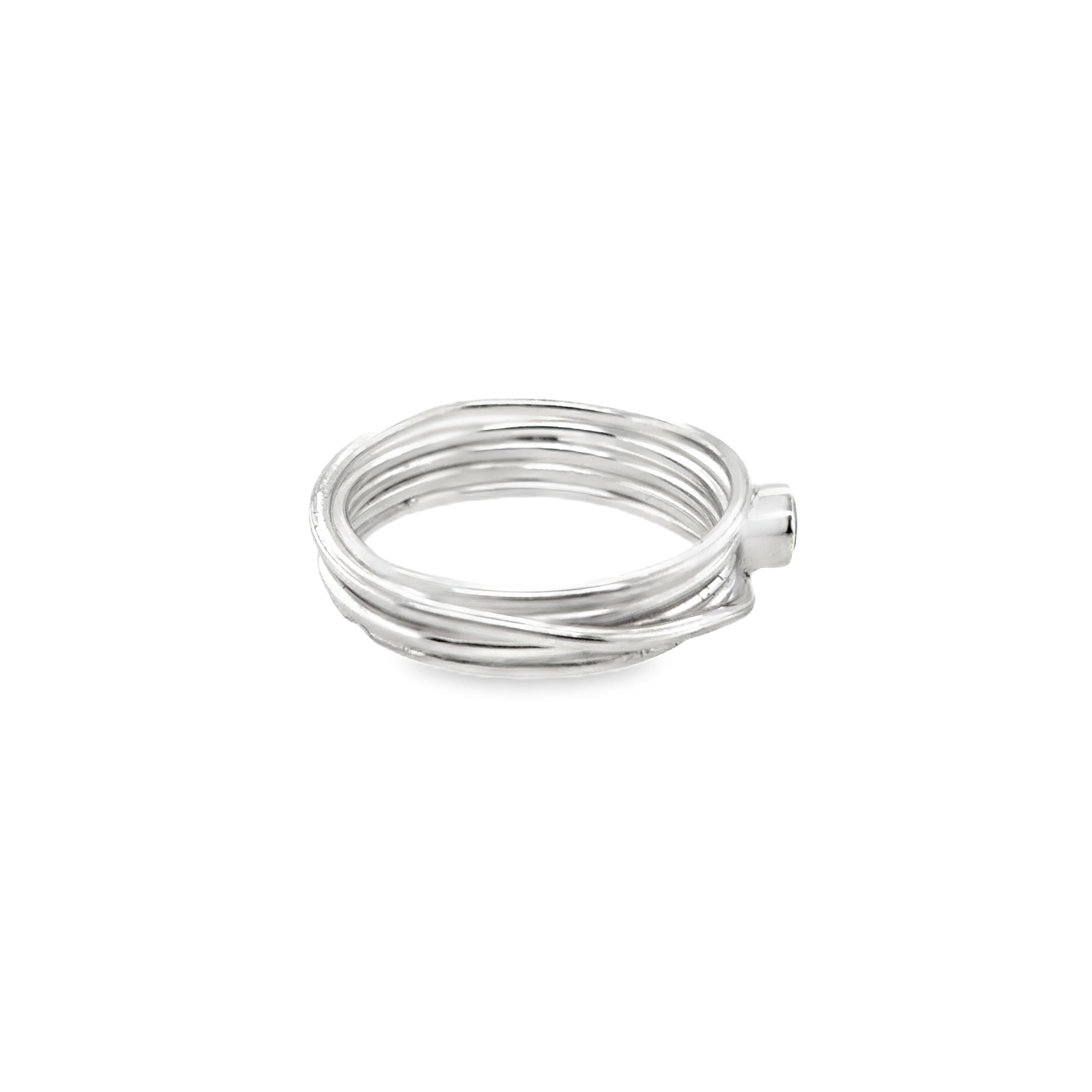 Faceted aqua marine stone set on a silver 5 wrap narrow Ring