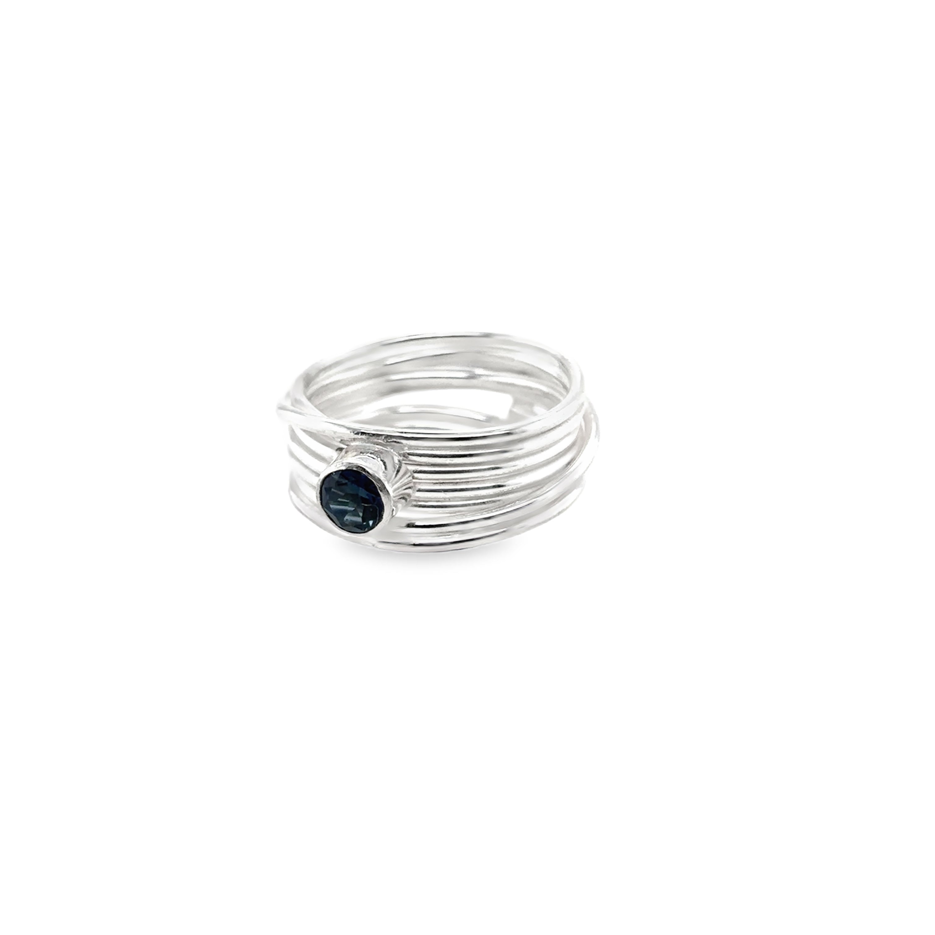 Faceted London blue topaz stone set on a silver 7 wrap ring