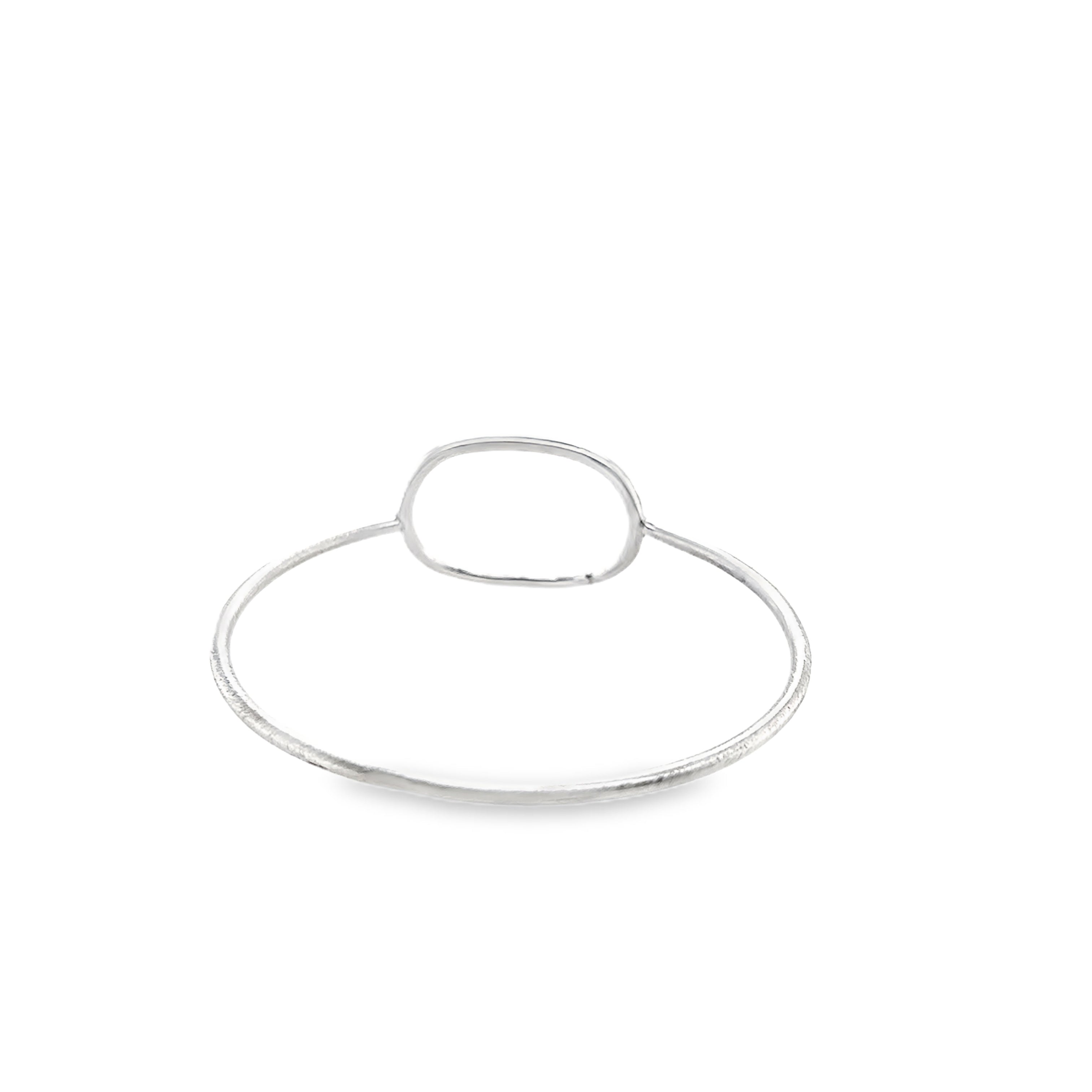 Silver oval bangle with a scratch matt finish