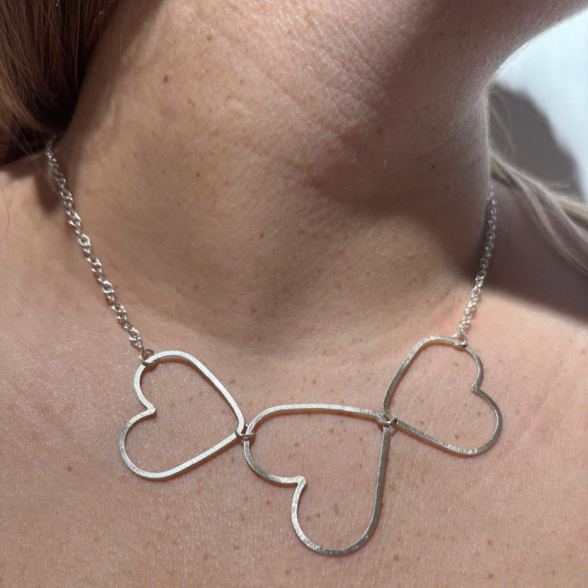Three linked flat silver heart Necklace