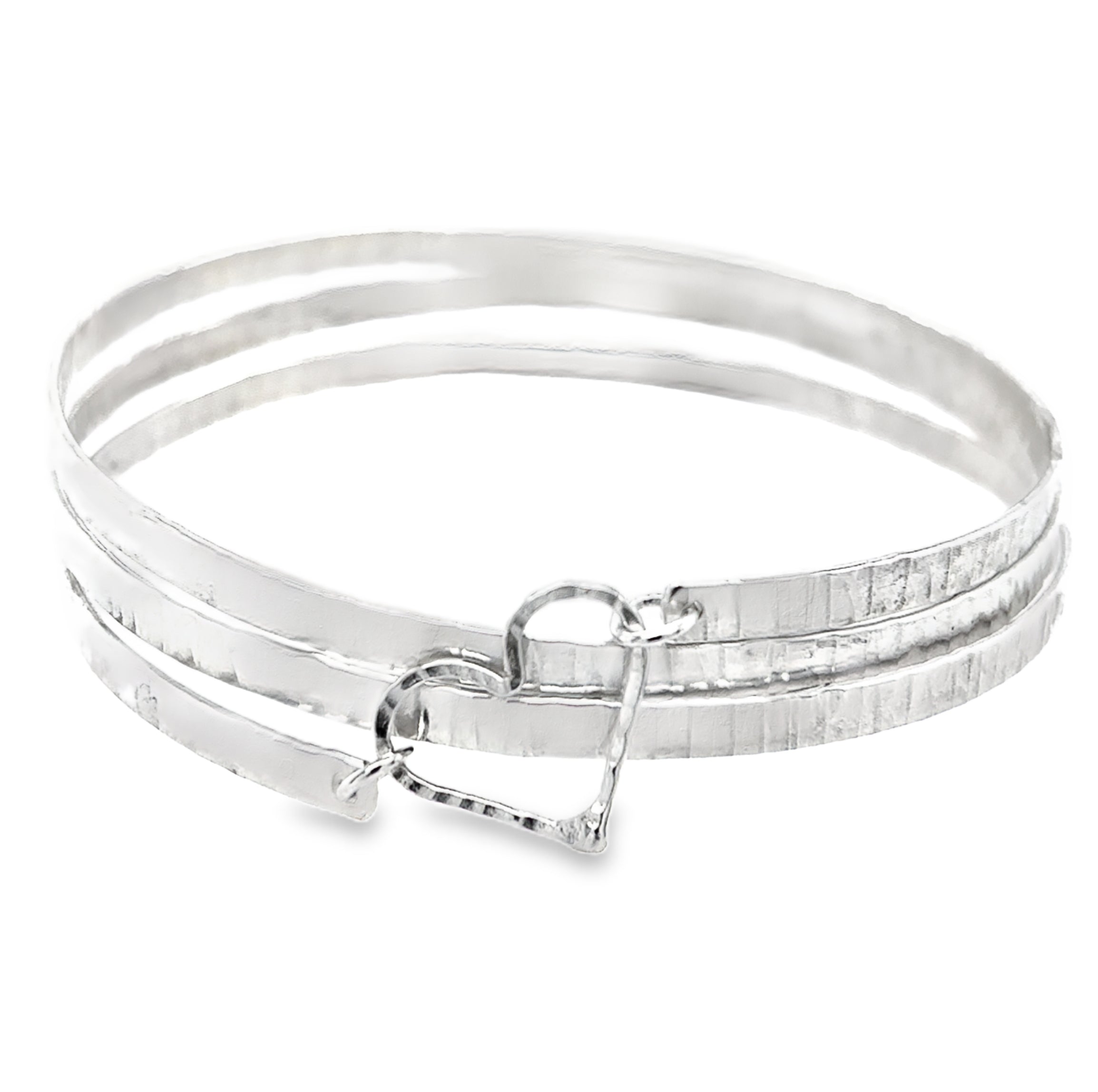 Hammered three spiral textured silver bangle with silver heart
