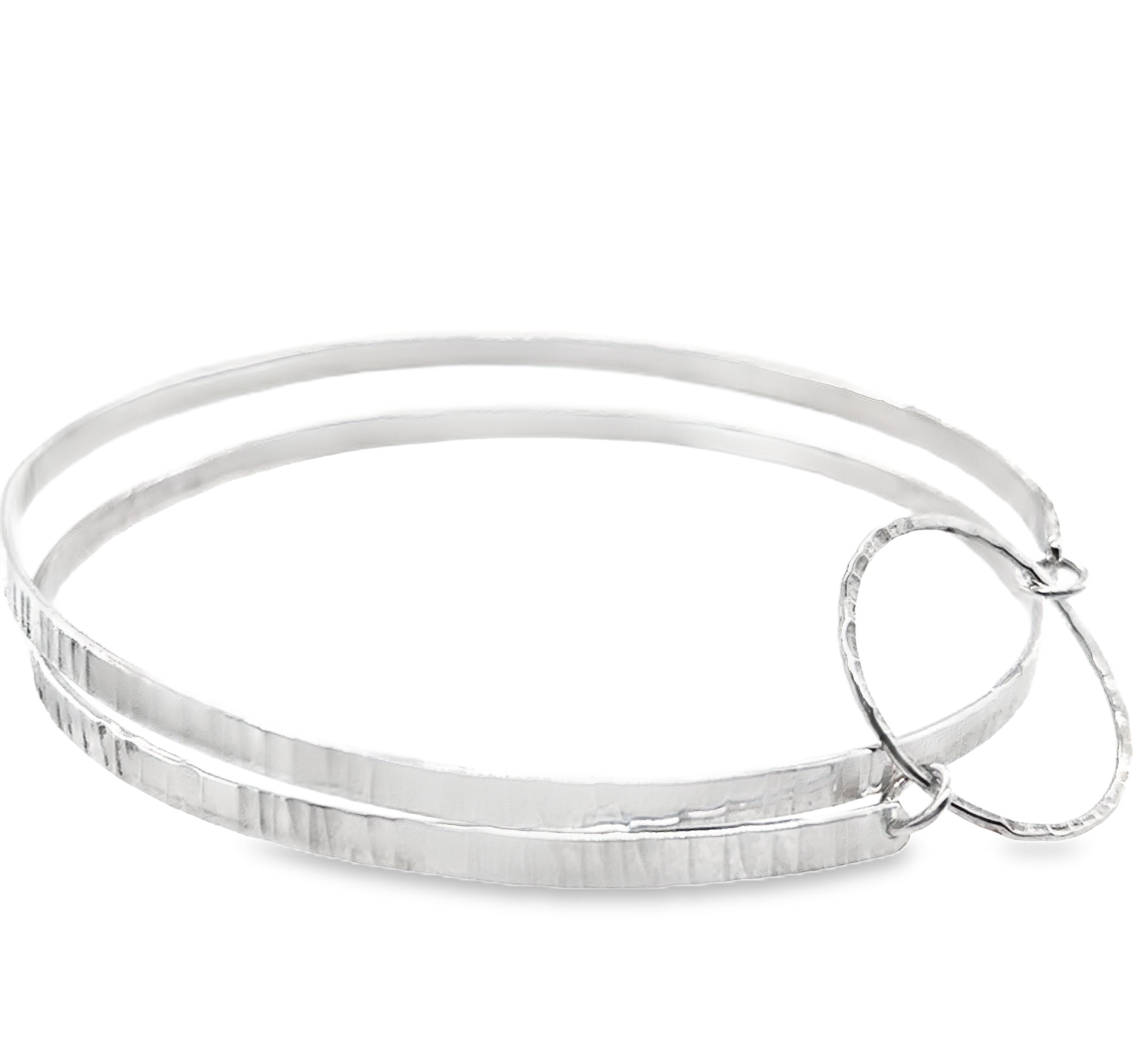 Hammered two spiral textured silver bangle with silver heart