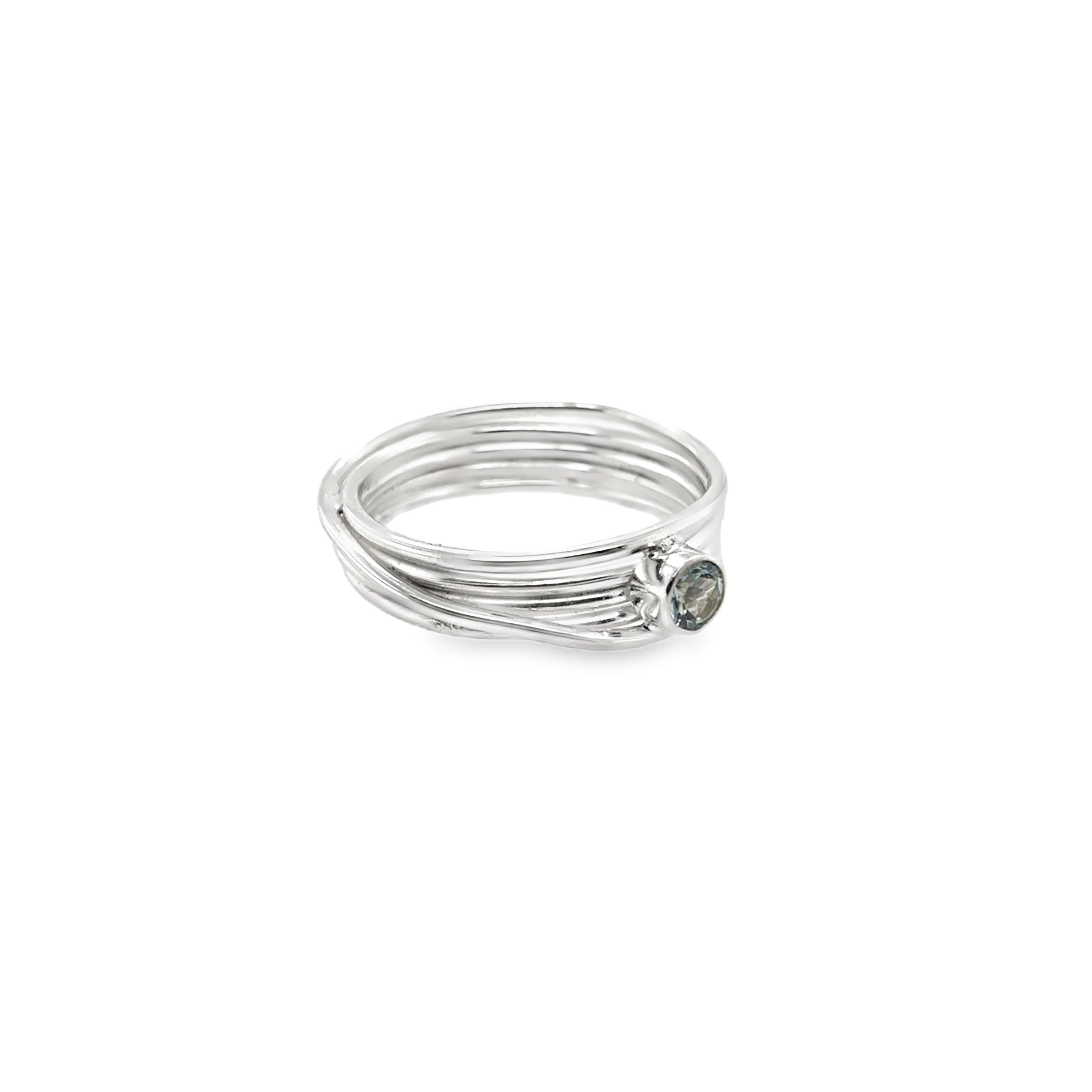 Faceted aqua marine stone set on a silver 5 wrap narrow Ring