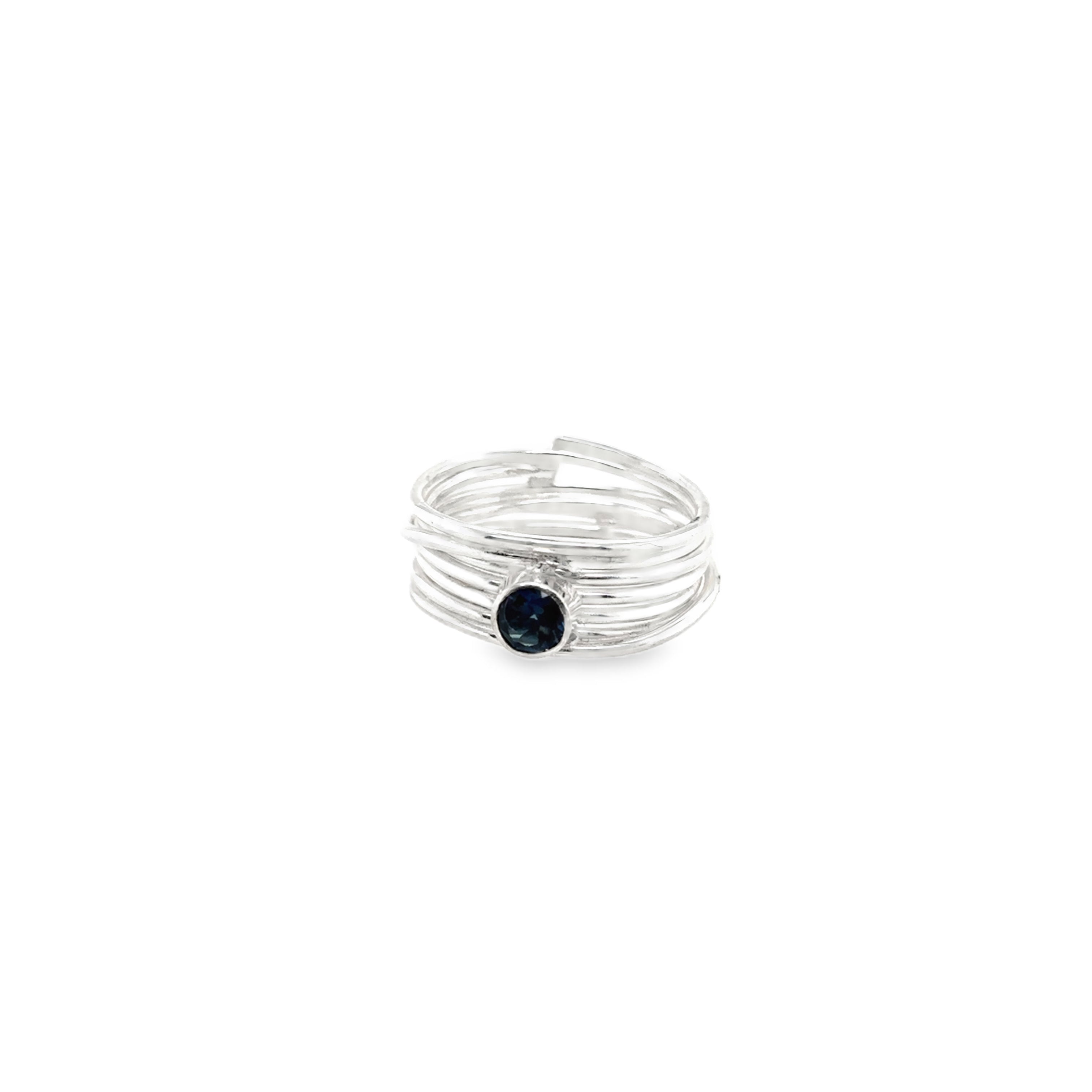 Faceted London blue topaz stone set on a silver 7 wrap ring