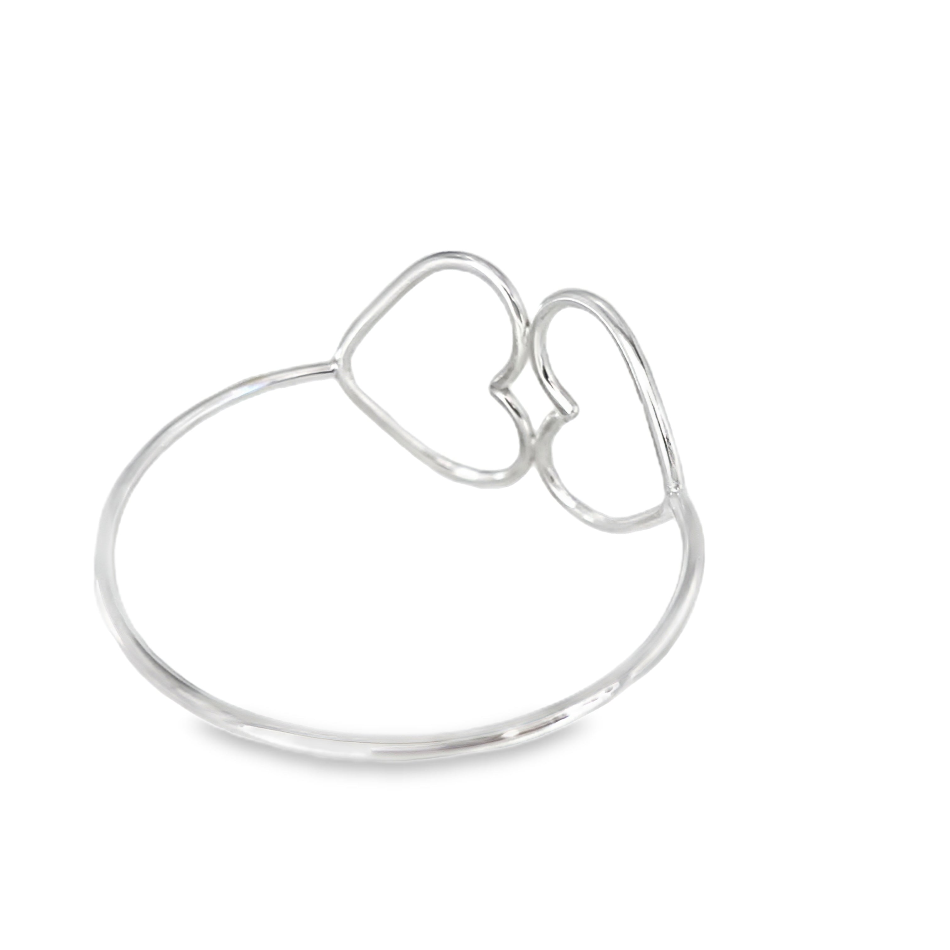 Polished silver oval bangle with two hammered heart