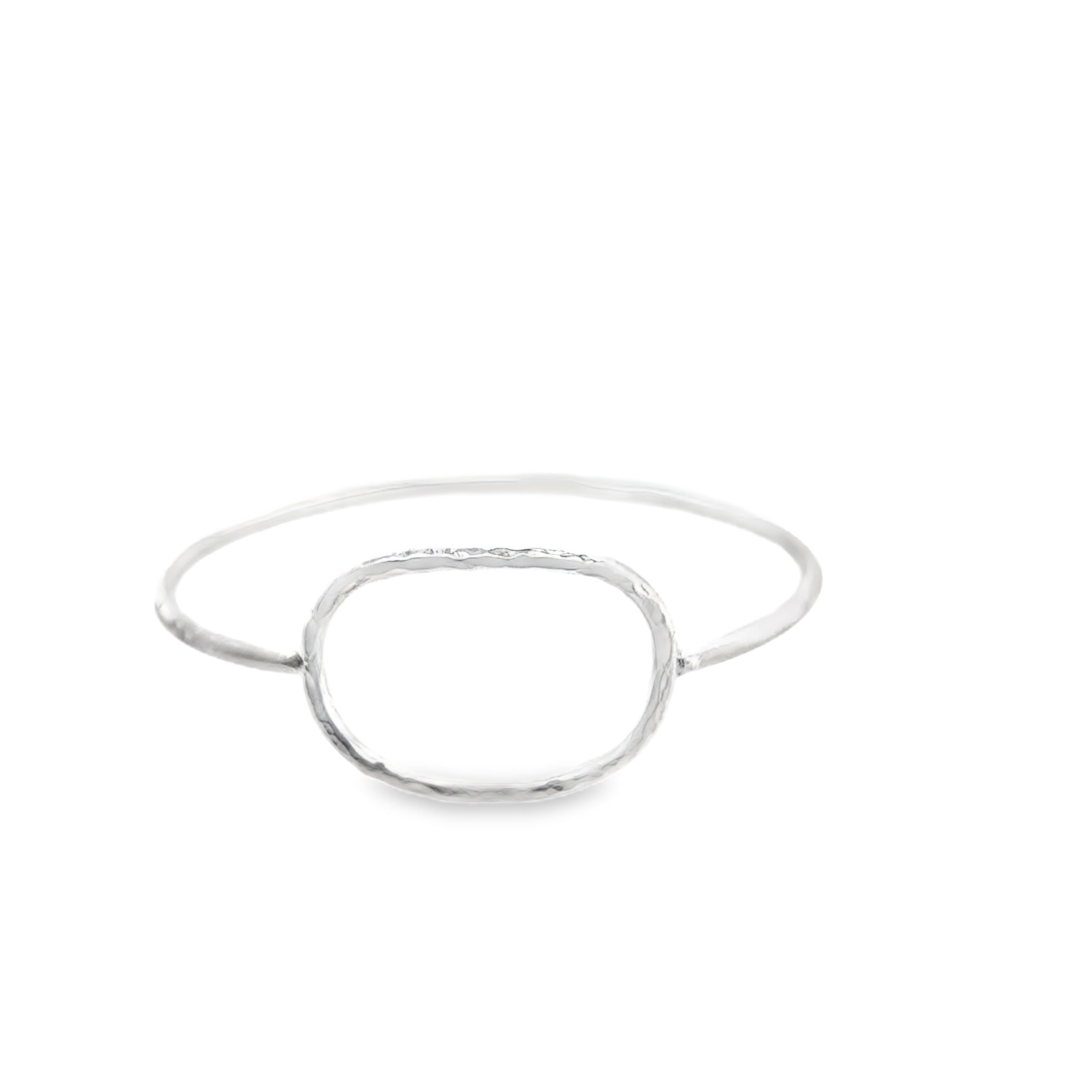 Silver oval bangle with a scratch matt finish