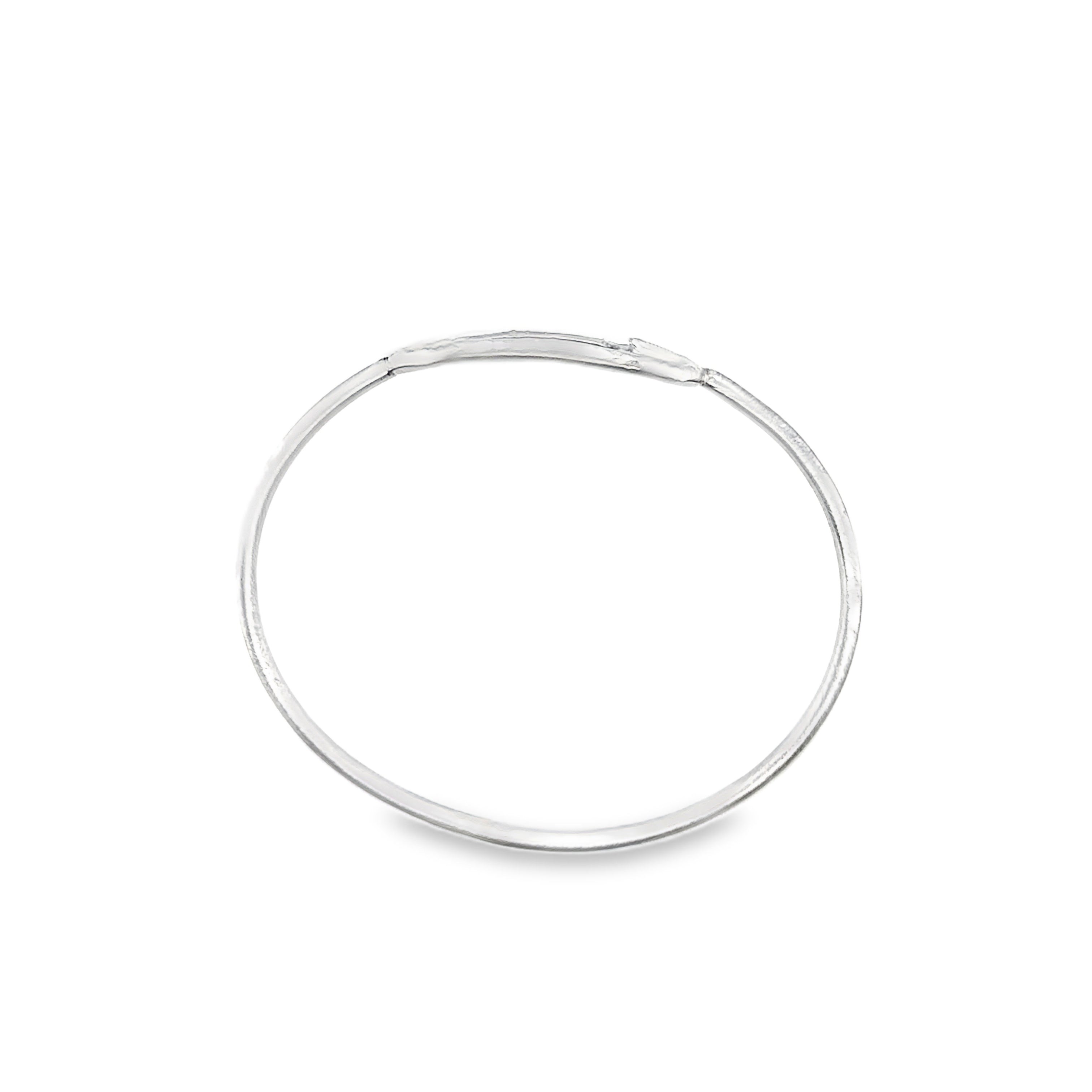 Silver oval bangle with a scratch matt finish