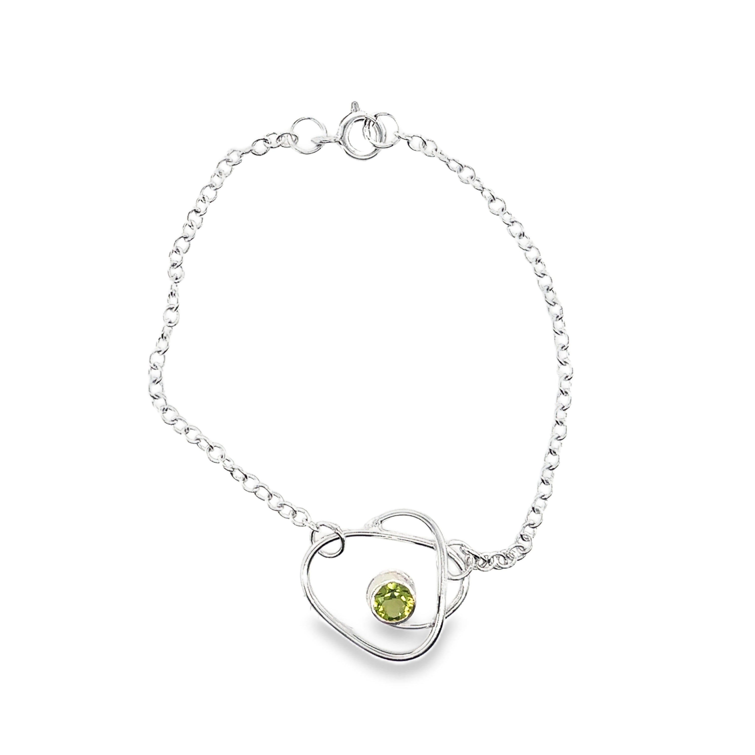 Faceted peridot set on a silver wrap bracelet