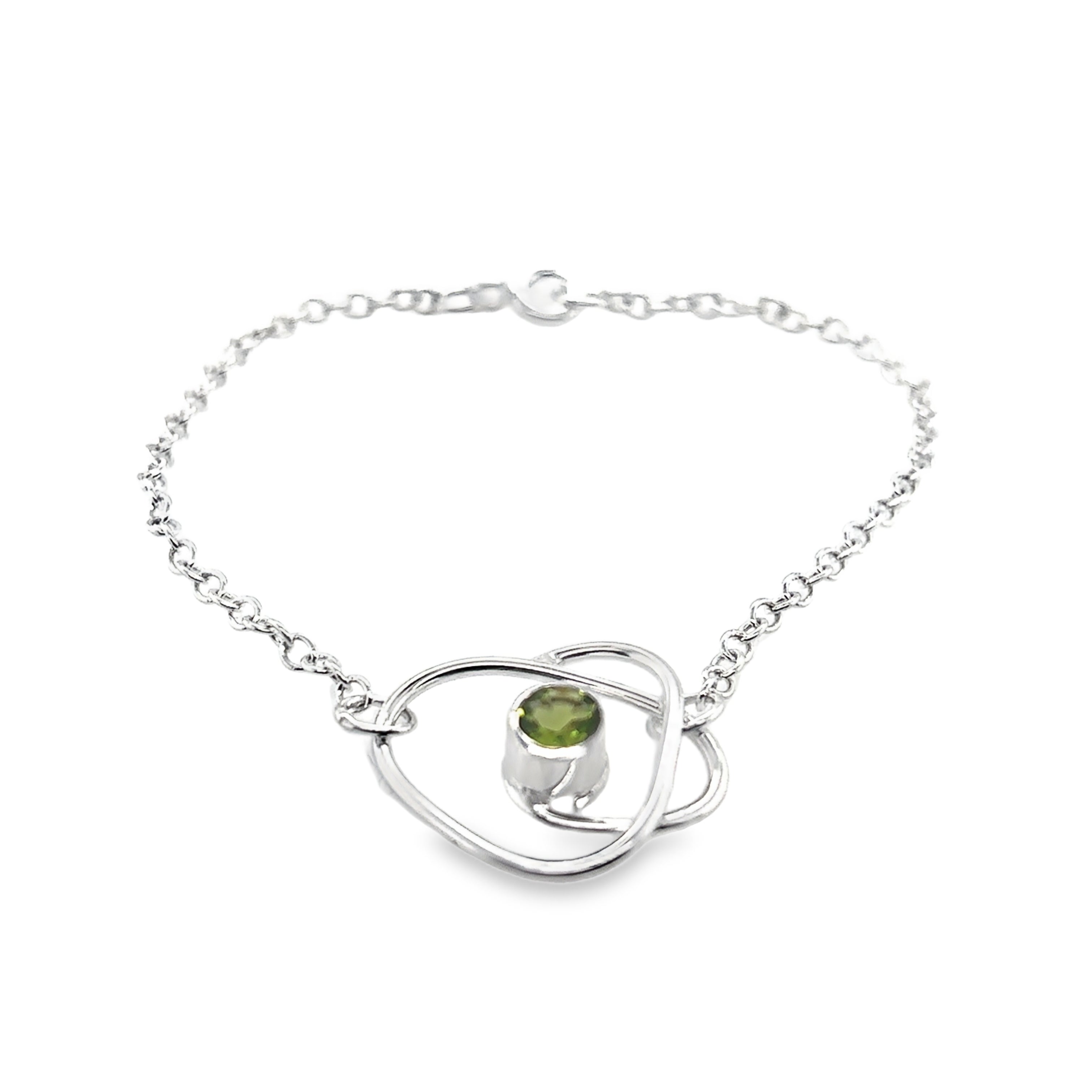 Faceted peridot set on a silver wrap bracelet